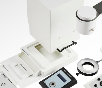 Flatlay photo of various accessories that can be used with TAGARNOs digital microscopes