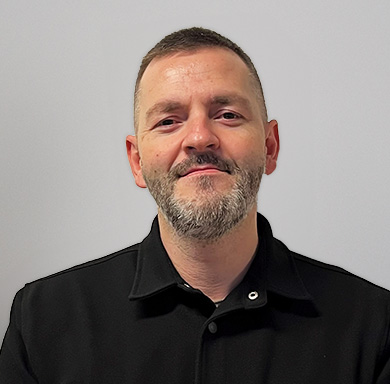 Ondrej Chrappa, Regional Sales Manager, at TAGARNO in black polo t-shirt in front of grey wall